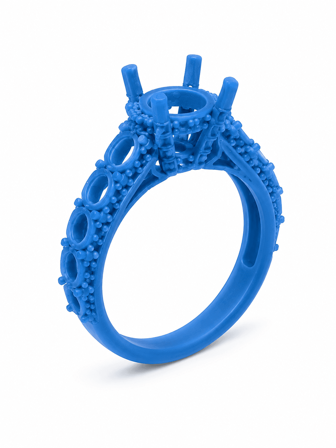 The ring as a blue cast-resin manufacturing model, with empty settings where the diamonds will sit.
